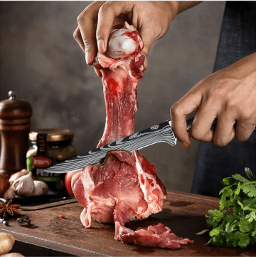 couteau de cuisine damascuskitchenknives couteau désossage en action sur épaule de boeuf